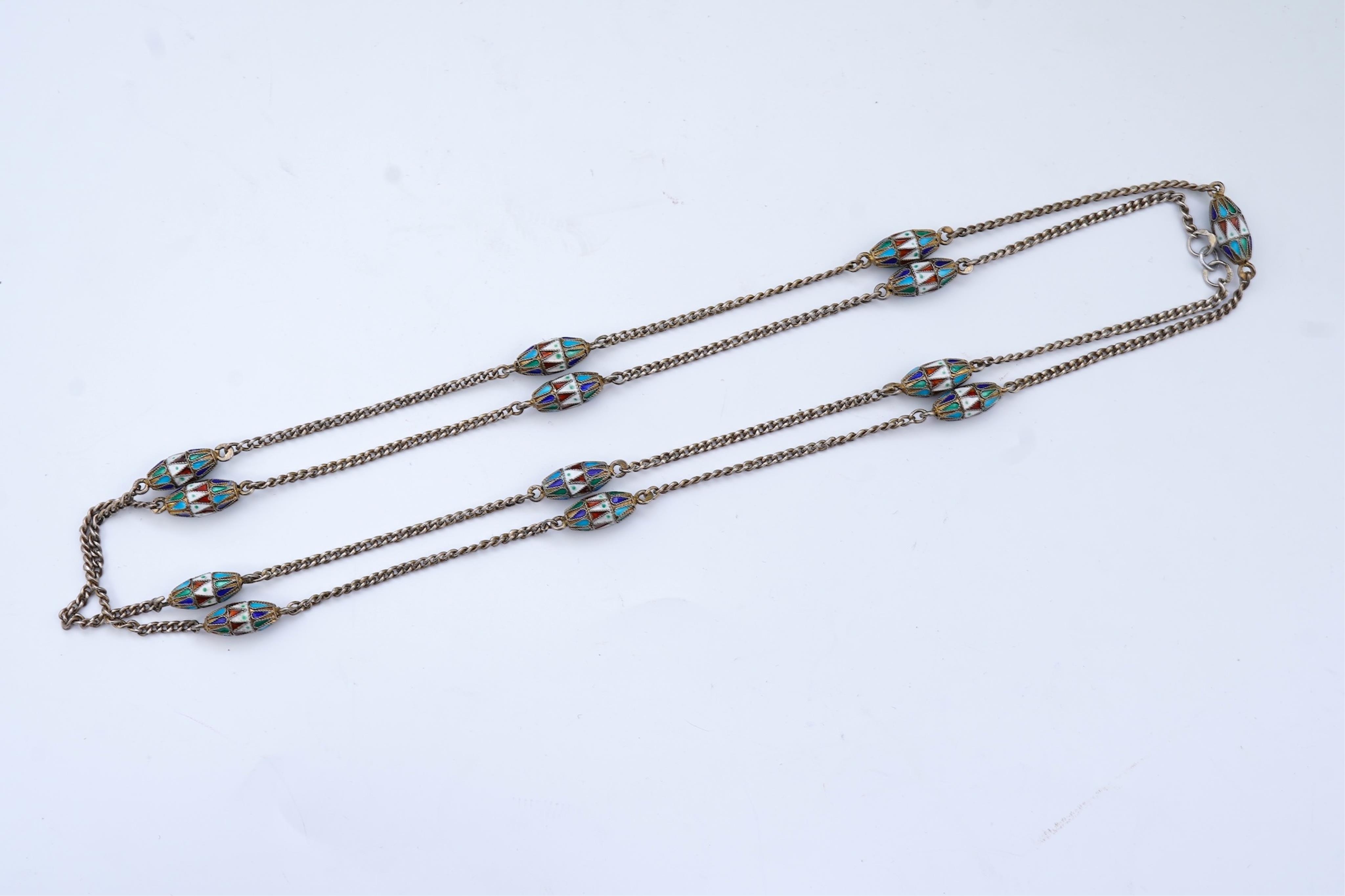 A silver and enamel long chain necklace, Russia, early 20th century